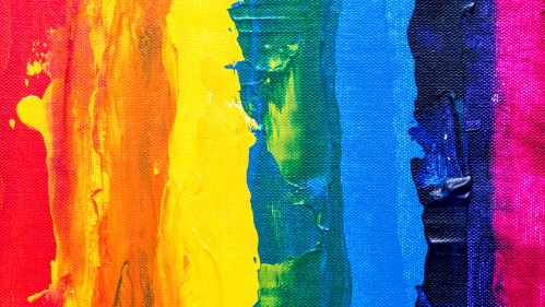 A roughly painted rainbow of oil paints