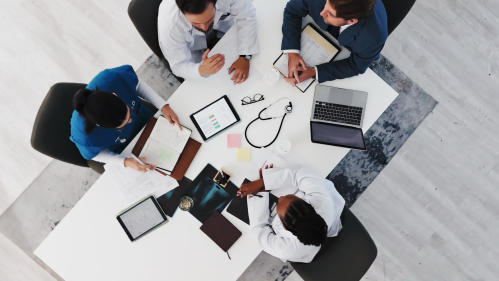 An overhead photo of clinicians working around a table 
