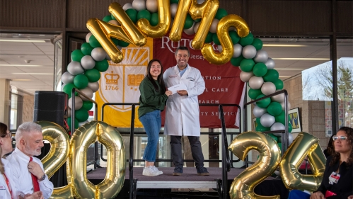 Esther Jang learns where she will match during New Jersey Medical School's Ceremony