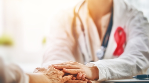 Oncologist consoling patient