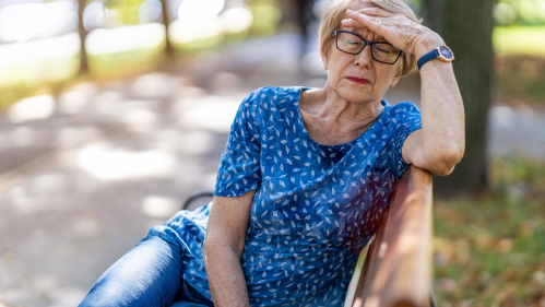 exhausted woman on bench