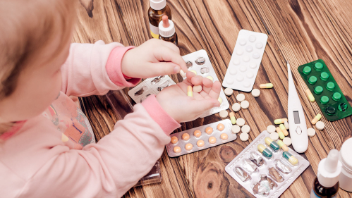toddler plays with prescription meds