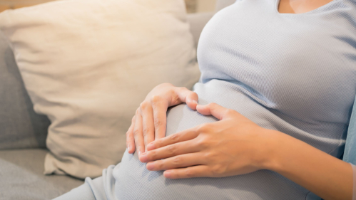 Pregnant woman on couch
