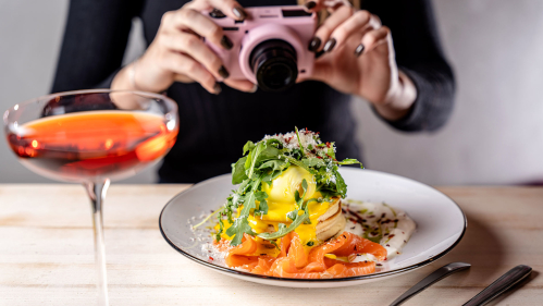 influencer photographs food and cocktail