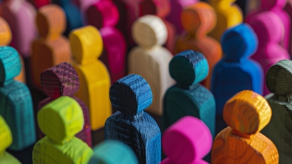 Multicolored wooden stick figurines depicting people