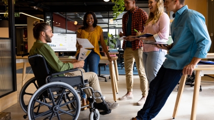 Stock art that shows a person in a wheel chair in the workforce