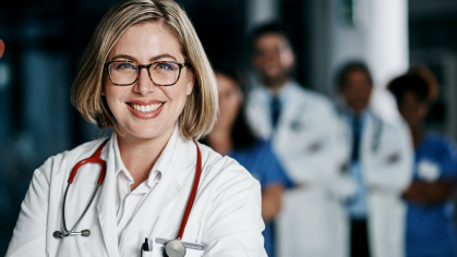 A night shift doctor wearing a white coat and stethoscope