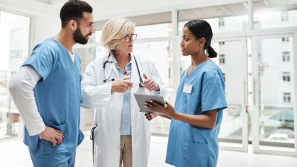 A doctor talks with residents in a hospital 