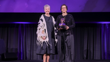 Dean Feldman, right, receives her award from Marsha Pyle, president of the American Dental Education Association’s Gies Foundation on a March 10 ceremony. 
