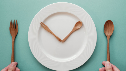 knife and spoon arranged like clock hands on plate