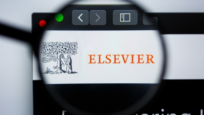 Magnifying glass over Elsevier website 