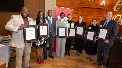 President William F. Tate IV stands with Advocacy, Outreach, & Support (DOS-AOS) team PEER Honorees for the Rutgers Gateway Award (Service to Students) (l. to r.) Halston Fleming, associate dean for case management, Pamela Harris, Office Manager and Administrative Assistant, Victoria Miller-Butcher, Assistant Dean for case management, Elizabeth O'Connell-Ganges, associate dean for student success, Lauren Kerton, senior coordinator, Sandra (Rocio) Castro, associate dean of students, Jeff Broggi, senior assoc