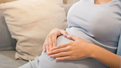 Pregnant woman on couch