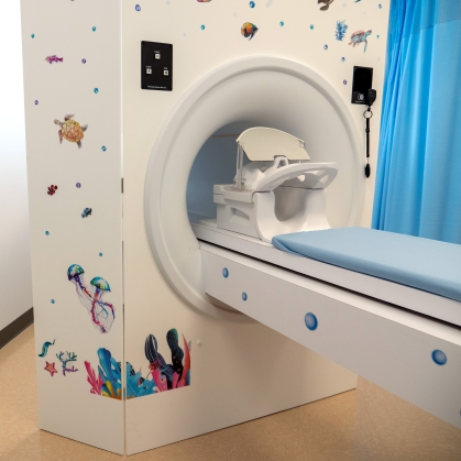 A brain scan machine is decorated with ocean life stickers in the Rutgers Brain Health Institute