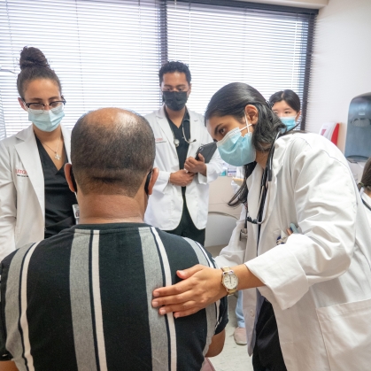 Medical students examine a patient at the Student Family Health Care Center