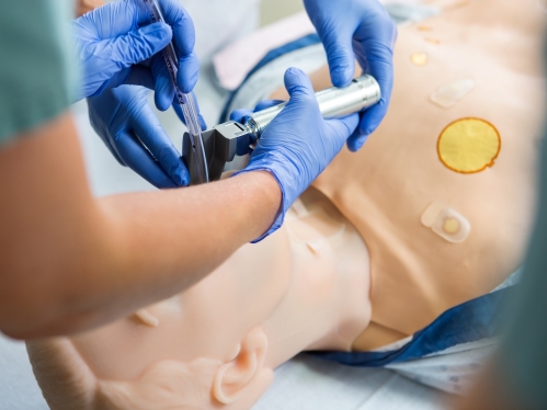 Medical students practice an intubation in a simulation lab