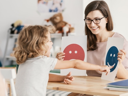 therapist treats girl with ASD