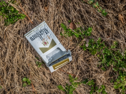 cigarette pack on ground