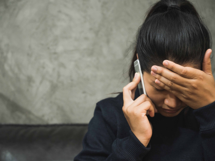Depressed person making a phone call