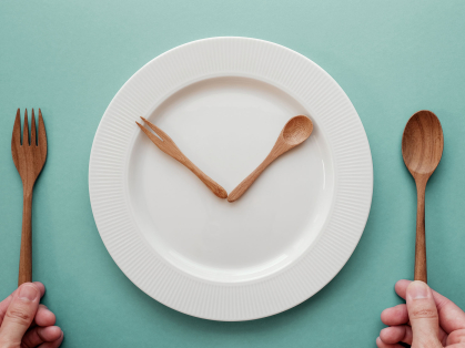 knife and spoon arranged like clock hands on plate