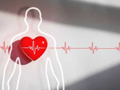 A red heart imposed over a sillouette of a person