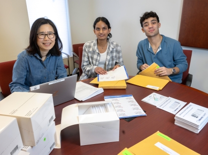 Students assemble and prepare distribution of home stool test kits at the Eric B. Chandler Health Center