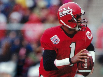 Ray Lucas is shown in his Rutgers gear on the field holding a football