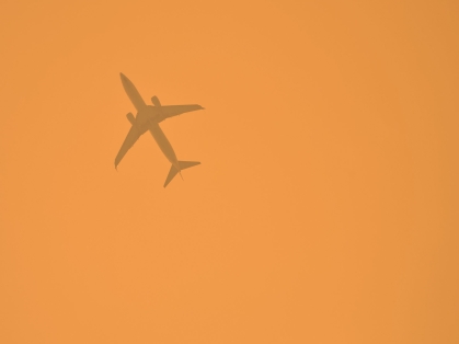 jet seen through wildfire smoke