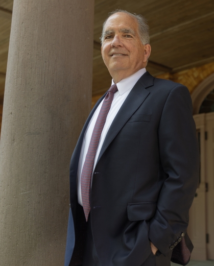 Pete McDonough stands beside a pillar outside a building at Rutgers