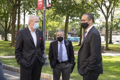 NJ Governor Phil Murphy, RBHS Chancellor Brian Strom and President Jonathan Holloway talk after meeting held on the lawn of Old Queens about the Coronavirus pandemic.