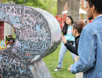 Attendees may decorate giant Rs at the R Garden on Voorhees Mall.