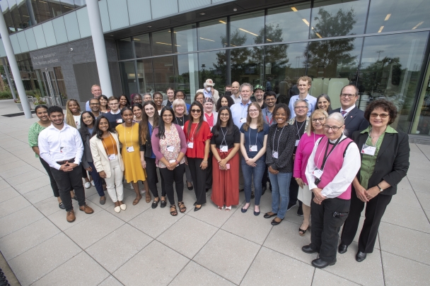 Outdoor group photo of One Health Conference speakers and student volunteers