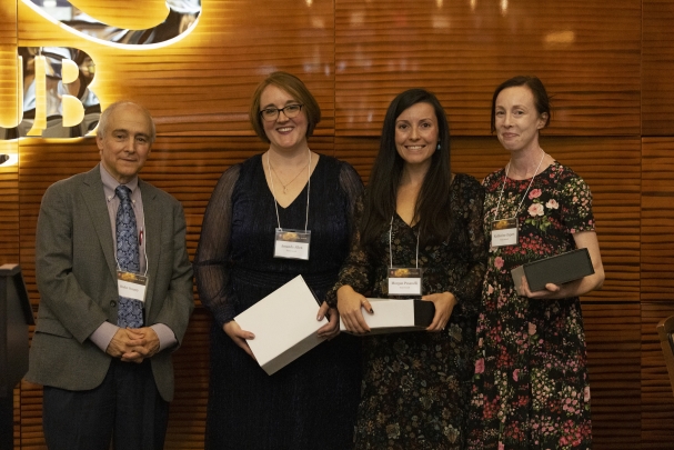 Senior Vice Chancellor Bishr Omary and Amanda Allen, Morgan Pesanelli, and Katherine Zapert, recipients of a Team Award.