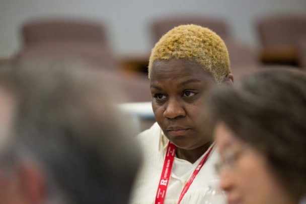 Participants talk in groups at the Integration Summit 