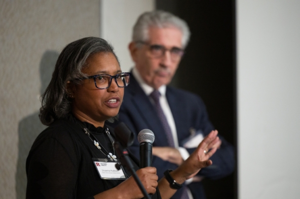 Two speakers give a presentation during the integration summit