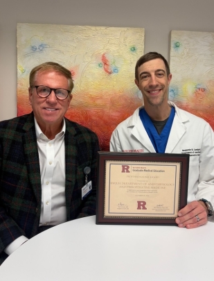 Anesthesiology department team members hold an award