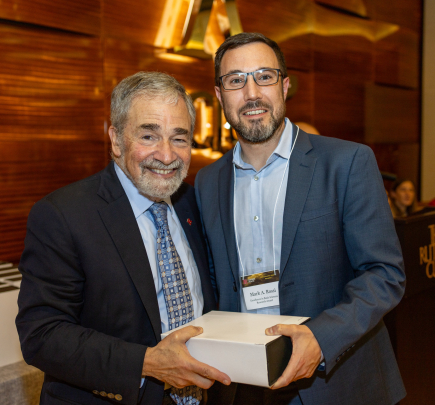 Chancellor Strom and Mark A. Rossi, recipient of the Excellence in Basic Sciences Research Award – Early Career Investigator.