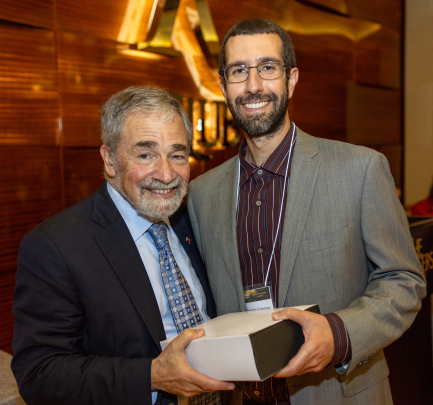 Chancellor Strom and Alexander Valvezan, recipient of the Excellence in Basic Sciences Research Award – Early Career Investigator.
