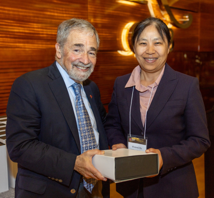 Chancellor Strom and Wenwei Hu, recipient of the Excellence in Basic Sciences Research Award – Established Investigator.
